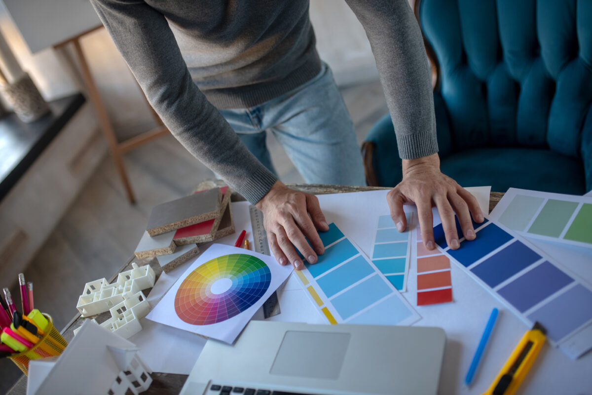 Color palette. Professional interior designer looking at color palette while choosing color